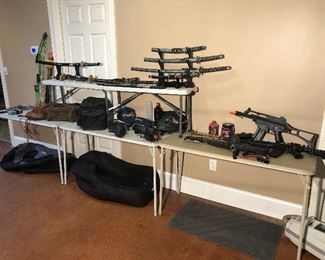 Lower Level:  Samurai and Katana swords; a GENESIS compound bow & arrows; boots; CABELA's canvas bags; paint ball equipment; and BB guns are all displayed.  Some closer photos follow. 