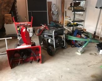 Garage:  Also available (from right to left) are:  a HONDA WB20XT water pump with HARPER suction hose attachment; BRIGGS & STRATTON 5500 watt generator Model No. 030235-00 (like new); and the TROY-BILT 24 inch 7.5 horsepower snow blower. You will be ready for whatever Mother Nature throws your way!