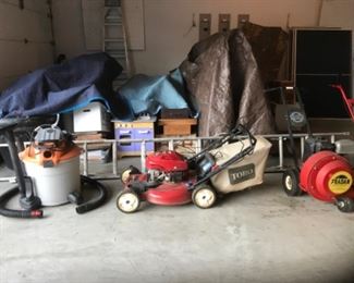 Garage: Shown are:  a TORO Recycler lawn mower; a 2-in-1 "6.5" horsepower, 16 gallon shop vac; and a commercial-quality FRADAN leaf blower [150 miles an hour] has lots of power!
