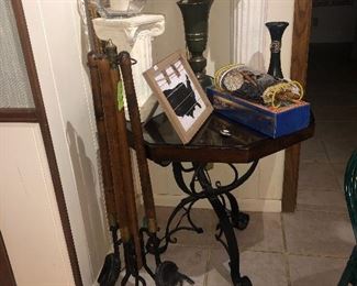 Wrought iron base table and long-handle fireplace tool set.