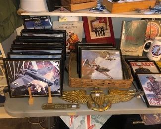 Lots of  framed airplane pictures 