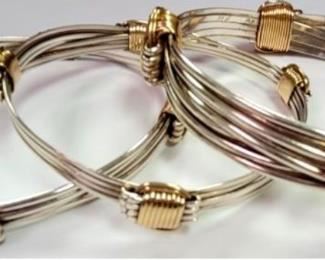 Three Sterling bangle bracelets with gold wire wrap accents, 109.5 gms