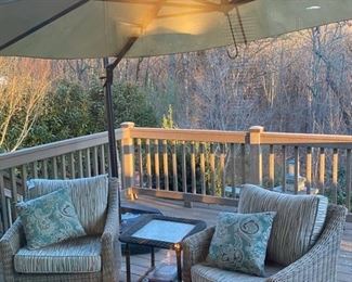 Outdoor swivel chairs, large umbrella, side table