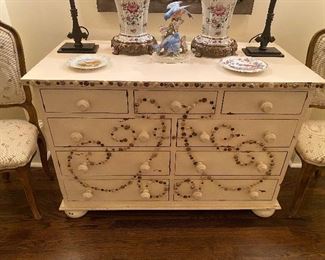 Guild Master 9 drawer chest with button appliqués. 