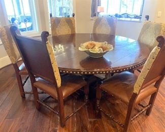 Sarreid 6 ft. round table with 6 leather seat chairs