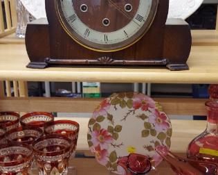 Mantle clock made in Great Britain, cranberry cut-to-clear goblets, silver crest Fenton milk glass items.
