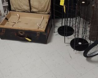 Antique trunks, revolving display racks