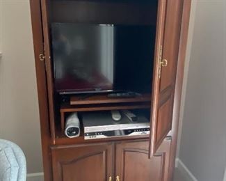 4 Door TV Armoire with Swivel Base for Television, TV sold separately.