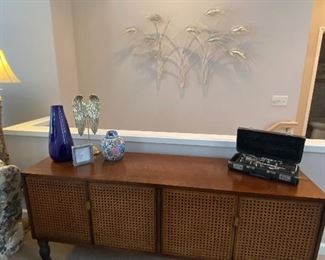 Vintage Buffet Cabinet with Woven Cane Door Panels, Clarinet in Case, Cream Metal Wall Décor