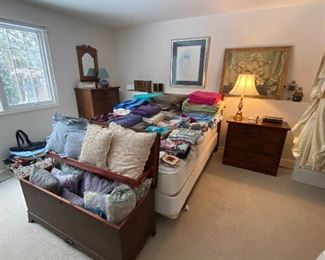 View of Lower Bedroom, Linens, Cedar Chest, Matching Queen Bed Frame, Dressers and Desk (desk not shown in photo),