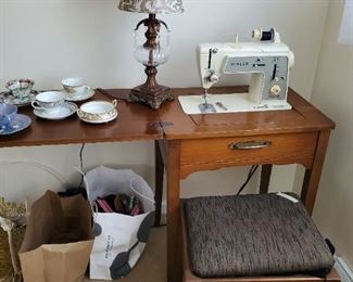 Sewing machine with cabinet (stool sold separately)