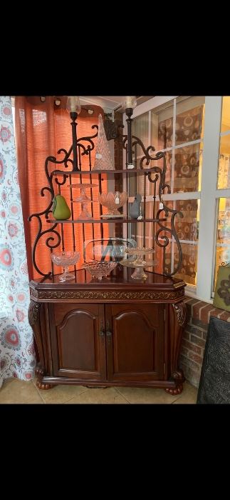 Heavy wood, glass and wrought iron bakers rack.