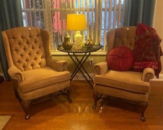 2 camel colored wingback chairs