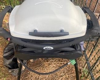 Weber portable gas grill.  This comes with the stand and a cover.