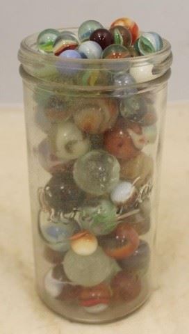 197 - Eureka Glass Jar Full of Marbles 7" x 3 1/2"
