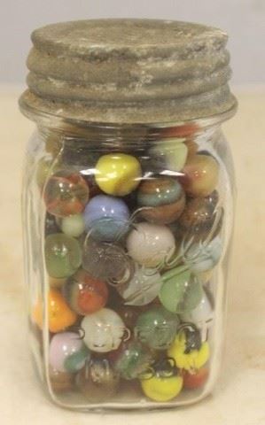 713 - Ball Mason Jar Full of Marbles 5 1/2 tall
