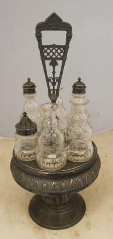 879 - Antique Silver Plate & Glass Caster Set 19 x 7 1/2 Missing 3 stoppers and chip on one bottle
