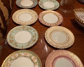 Antique Royal Doulton dinner plates in various colors/designs