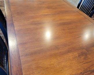 Dining Table with 6 Chairs and 2 extra leaves.