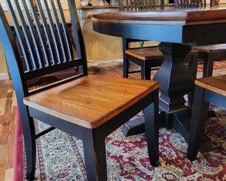 Dining Table with 6 Chairs and 2 extra leaves.