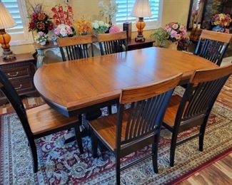 Dining Table with 6 Chairs and 2 extra leaves.