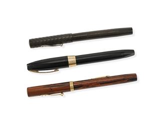 1003
Three Waterman And Sheaffer Fountain Pens
20th Century
Each with maker's marks
Comprising a Waterman's Ideal 52 Red Ripple, and Watterman's Ideal 52, and a Sheaffer Pen for Men III, 3 pieces
Each: 5.375" L approximately
Estimate: $300 - $500