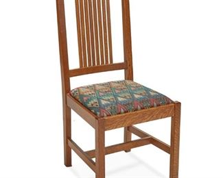 1007
A Contemporary Stickley Oak Chair
1995; Manlius, NY
With Stickley burned mark; further dated and numbered: MAR 13 1995 / # 35
The spindle back chair with polychrome fabric upholstered seat raised on four square legs joined by an H-stretcher
40.5" H x 17.5" W x 22" D
Estimate: $100 - $150