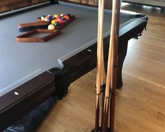 Olhausen 8 foot pool table & cues. $900.00. Call the movers.