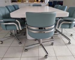 Fantastic Contemporary Dining Table and Chairs. The table chairs both have some light marks that can be seen in the photos, but all pieces are in overall great shape. The table includes two additional leaves that are not pictured. The table with out the leaves measures 42’ x 90” and 29” high. Each chair measures 22” wide, 19” deep, 17” high to the seat and 32” high to the chair back. 