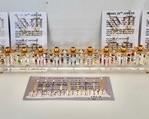 Lucite and Brass Ginzberg Menorah and Dreidels Commemorating the 50th Anniversary of Israel.

This brass and lucite grouping includes one Menorah and 4 Dreidels designed by Ginzberg (Israel) and fully handcrafted in Jerusalem. The Menorah measures 15.5 inches long and each Dreidel includes a stand.