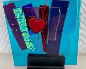 This beautiful multi-colored whimsical art glass tile by Alicia Kelemen measures 5x5 inches.