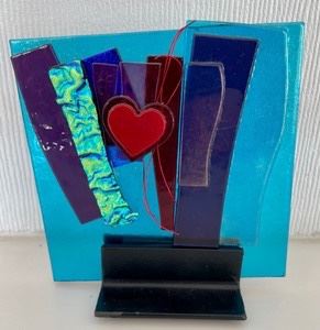 This beautiful multi-colored whimsical art glass tile by Alicia Kelemen measures 5x5 inches.