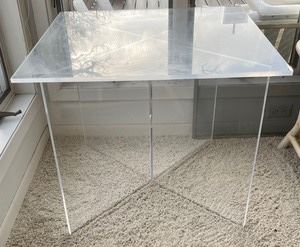 This lovely lucite table measures 30x30x24 inches.