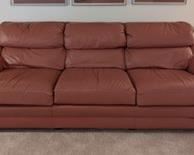 Classic Leather Sofa. This item matches the previous lot.  There are few imperfections on the lower front that can be seen in the photos. The sofa is in otherwise excellent condition. Measures 84” wide from arm to arm, 28” deep, 17” high to the seat and 30” high to the sofa back. 