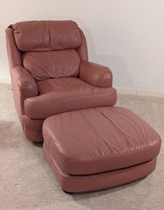 Classic Leather Armchair and Ottoman.  There are a few small marks, but both pieces are in otherwise excellent condition. The chair measures 32” wide from arm to arm, 28” deep, 17” high to the seat and 32” high to the chair back.