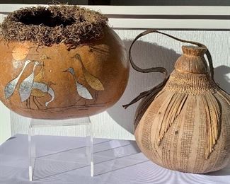 Two Gourd Art items. A decorative basket with painted birds and a gourd made vessel with strap and stopper. 