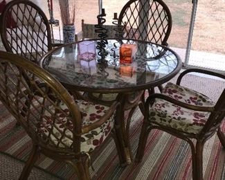 Glass topped ratttan table and 4 chairs