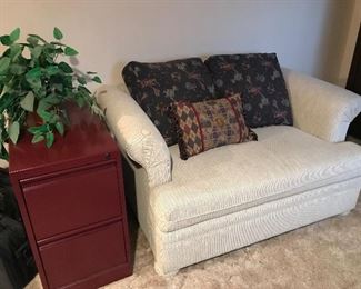 Upholstered love seat/roll away bed