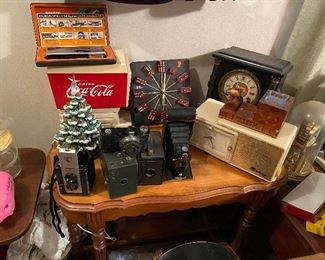 Vintage Cameras, Ceramic Christmas Tree, Bulova Radio, Dice Clock and more. 