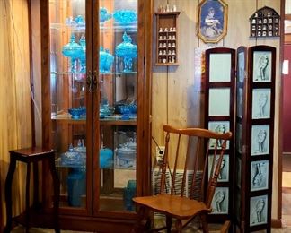 Unique small shelf table, loads of blue glass items, rocker, folding screen, thimble collection & framed print.                LIGHTED CURIO NOT FOR SALE