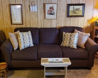 Sofa, pillows, novelty "bench" & framed prints.               