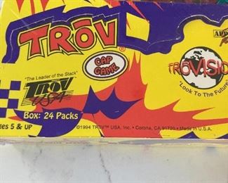Sealed in box: 24 packs of Trove caps, Each pack contains 5 trove caps, 1 trouncer. Randomly inserted Holograms and foil caps