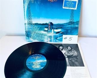 #5- Journey, $10, Raised on the Radio,Released:1986,Condition:Very Good
