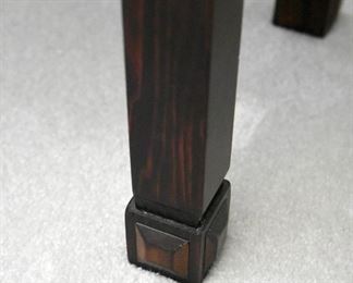 wooden chest with brass hardware (leg detail)