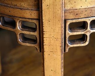 oval wooden table with lower shelf (detail)