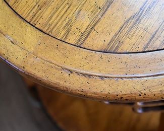 oval wooden table with lower shelf (top detail)