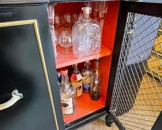 Vintage Black Lacquer Bar Cabinet  (4 cabinets, 2 shelf levels, and 1 central drawer)..painted red inside.