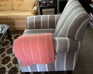 The Lifes a Beach Mist is a beautiful accent chair that features rolled arms, a tight back, a loose seat cushion with box border welt, chunky tapered legs in a coffee finish and a bright, colorful pattern.  Quantity 2. 