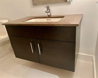 Bathroom vanity with marble top and polished chrome Grohe fixture 36.5"w x 21.5" deep x 21.25 high.  Priced at $200 (buyer will need to remove)