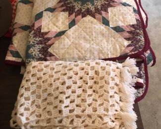 Quilt and knitted wrap.